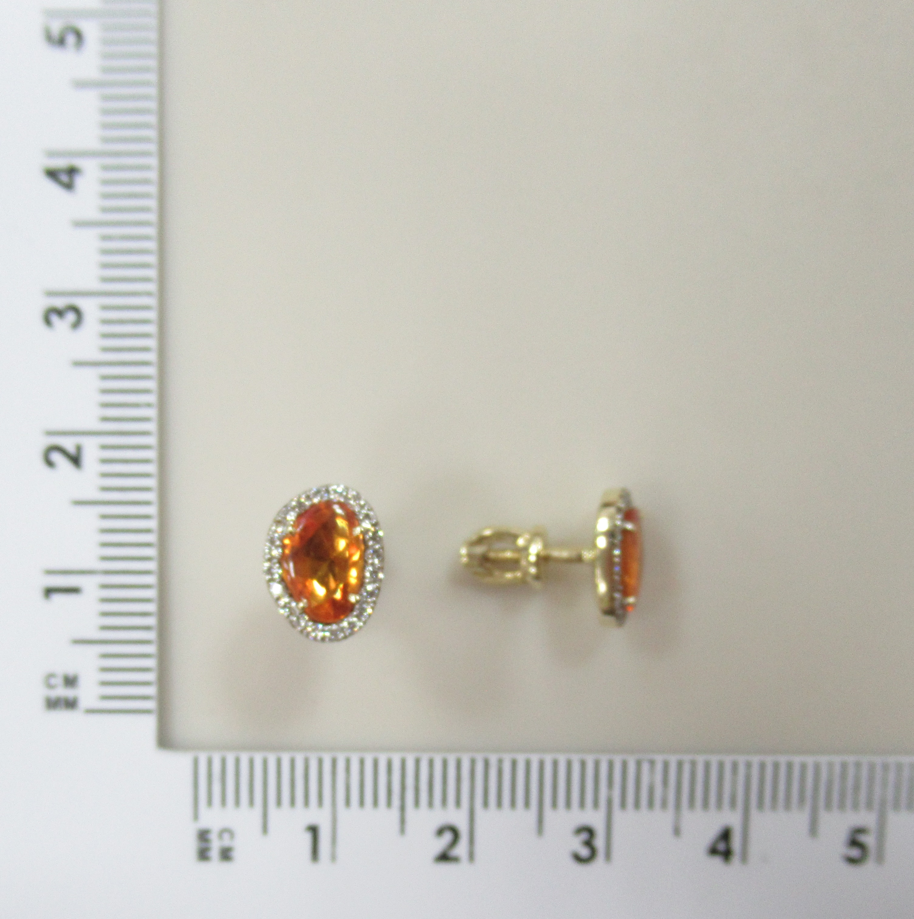 Серьги из желтого золота с оранжевыми сапфирами